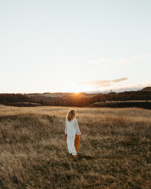 woman walking in open field